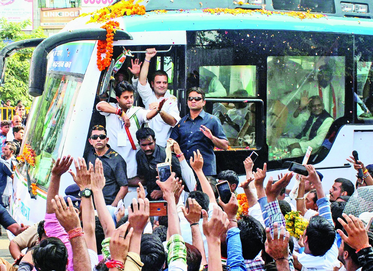 Rahul Gandhi  and Jyotiraditya Scindia at the road show in Bhopal on Monday. 