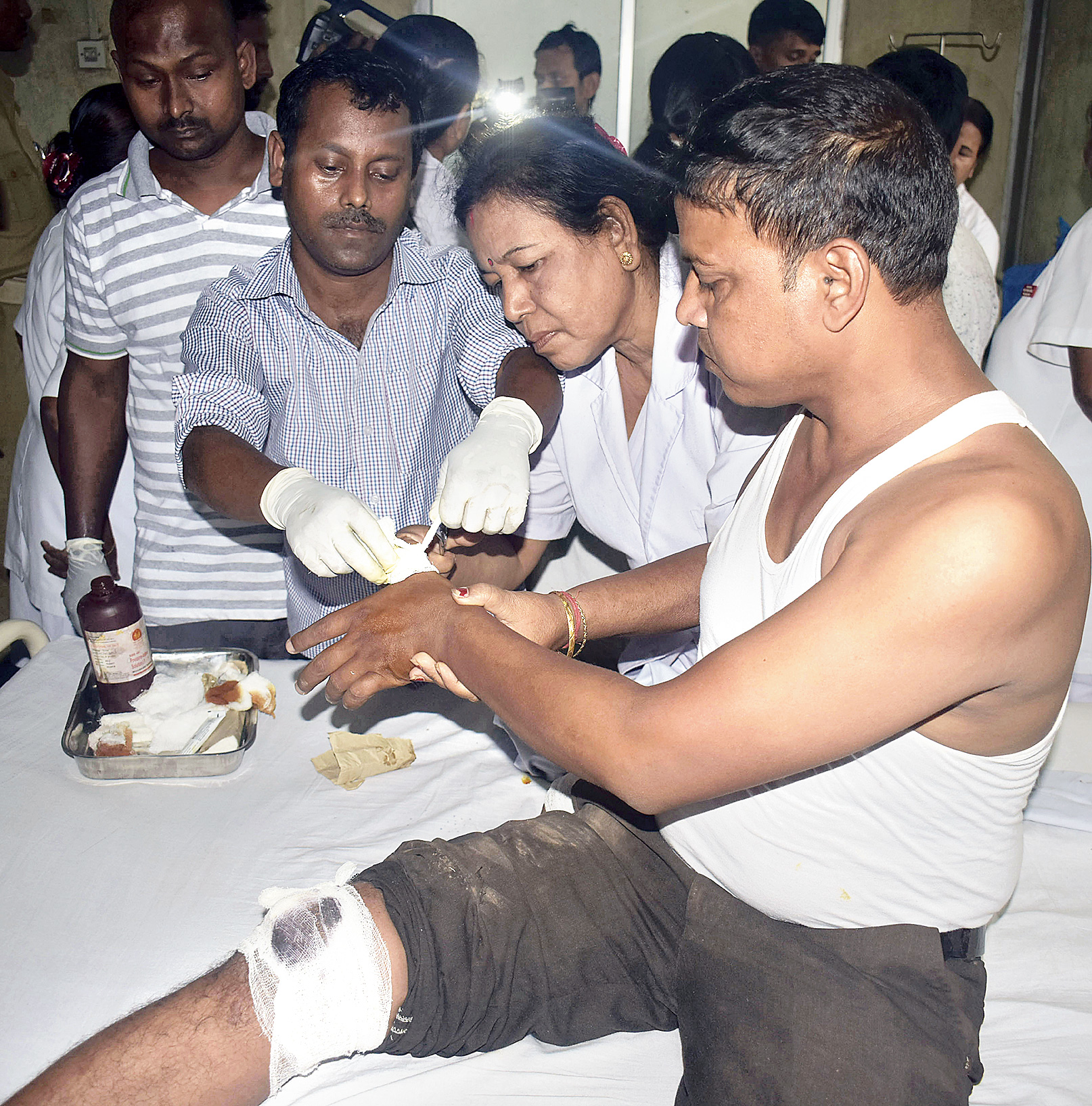 An injured person being treated at Mahendra Mohan Choudhury Hospital in Guwahati on Saturday.