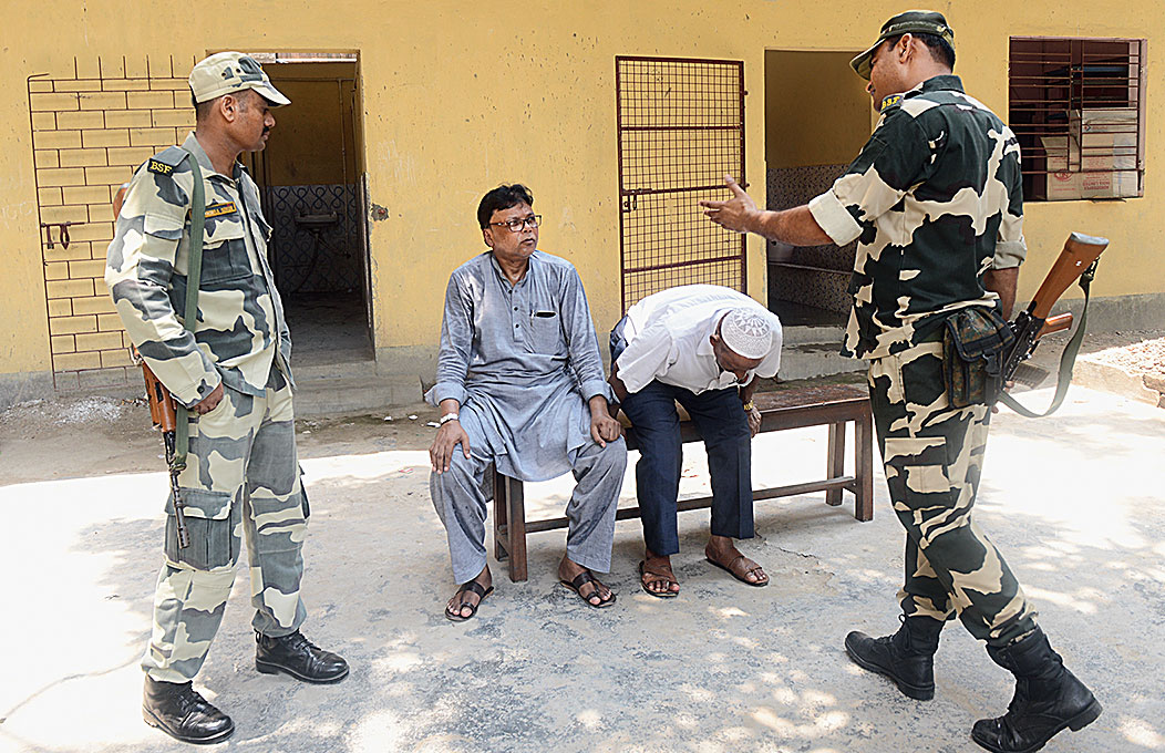 Paramilitary personnel ask men to leave a booth in Sealdah’s Victoria Institution on Sunday. 