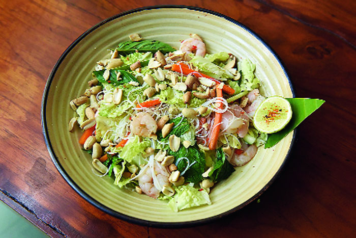 Love salads? This Vietnamese Vermicelli Salad is packed with herbs like Thai basil, lemongrass, Kaffir lime leaves and finely chopped galangal. The salad has lettuce along with carrots and cucumbers that are tossed in a sweet-and-sour sauce that has plum sugar and lemon juice. It is topped with crunchy peanuts and shrimps (optional).