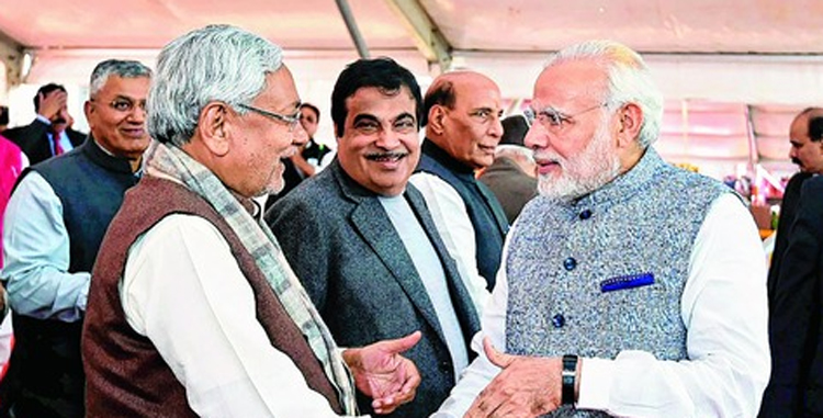 Prime Minister Narendra Modi greets chief minister Nitish Kumar at the swearing-in ceremony of the new Gujarat government in Gandhinagar in 2017.