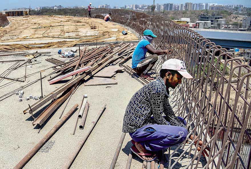 Work resumes on the National Highway amid the nationwide  lockdown in Navi Mumbai on Sunday. 