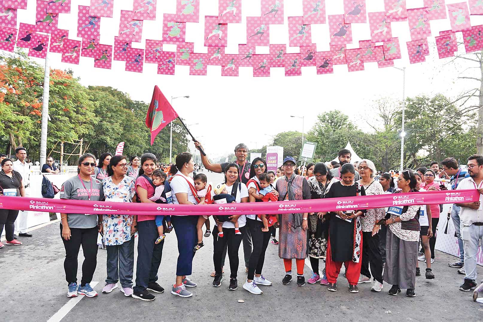 Milind Soman with the youngest participants, babies in slings carried by their mothers, at the start of the race called ‘Baby Wearing Moms’