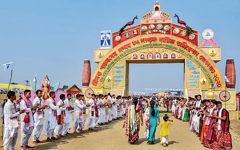 Visitors arrive at the 89th annual conference of Srimanta Sankaradeva Sangha in Golaghat on Thursday
