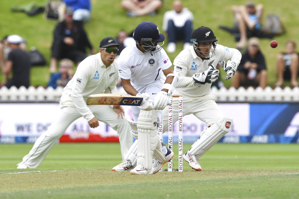 India's Ajinkya Rahane turns the ball past New Zealand's B.J. Watling during the first cricket test between India and New Zealand at the Basin Reserve in Wellington, New Zealand, Friday, February 21, 2020