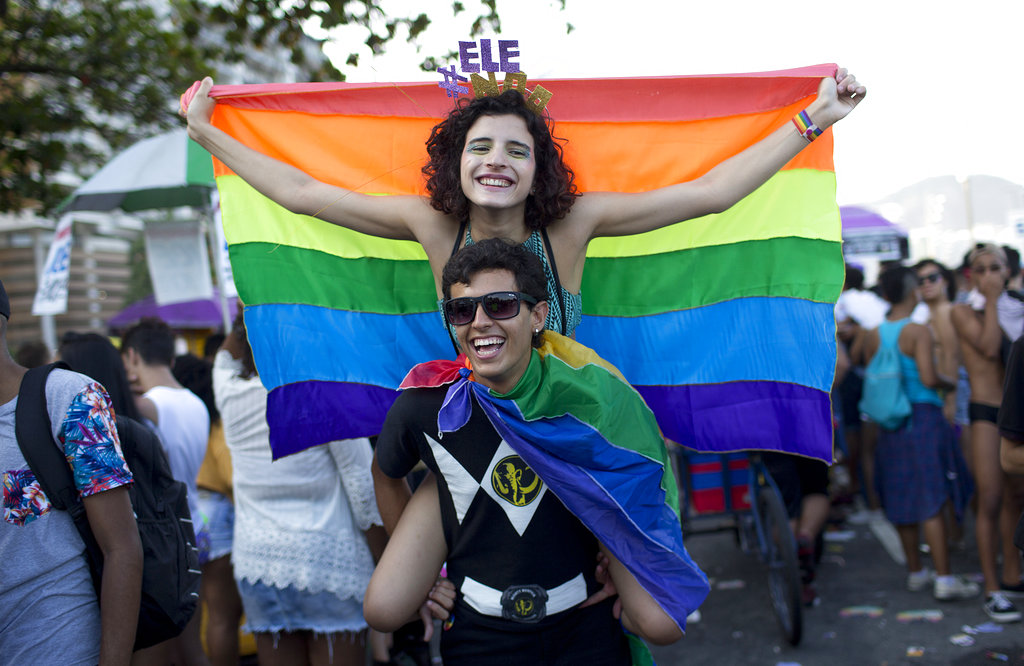 Revelers in rainbow flags.