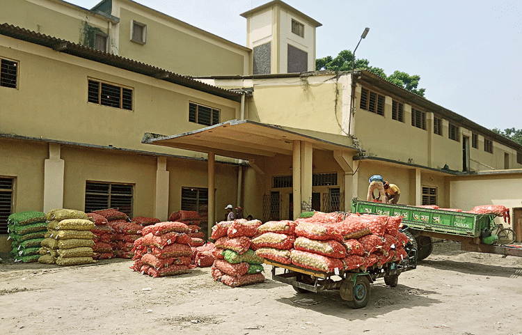 Potatoes stacked in front of a cold storage at Kalna in East Burdwan. 