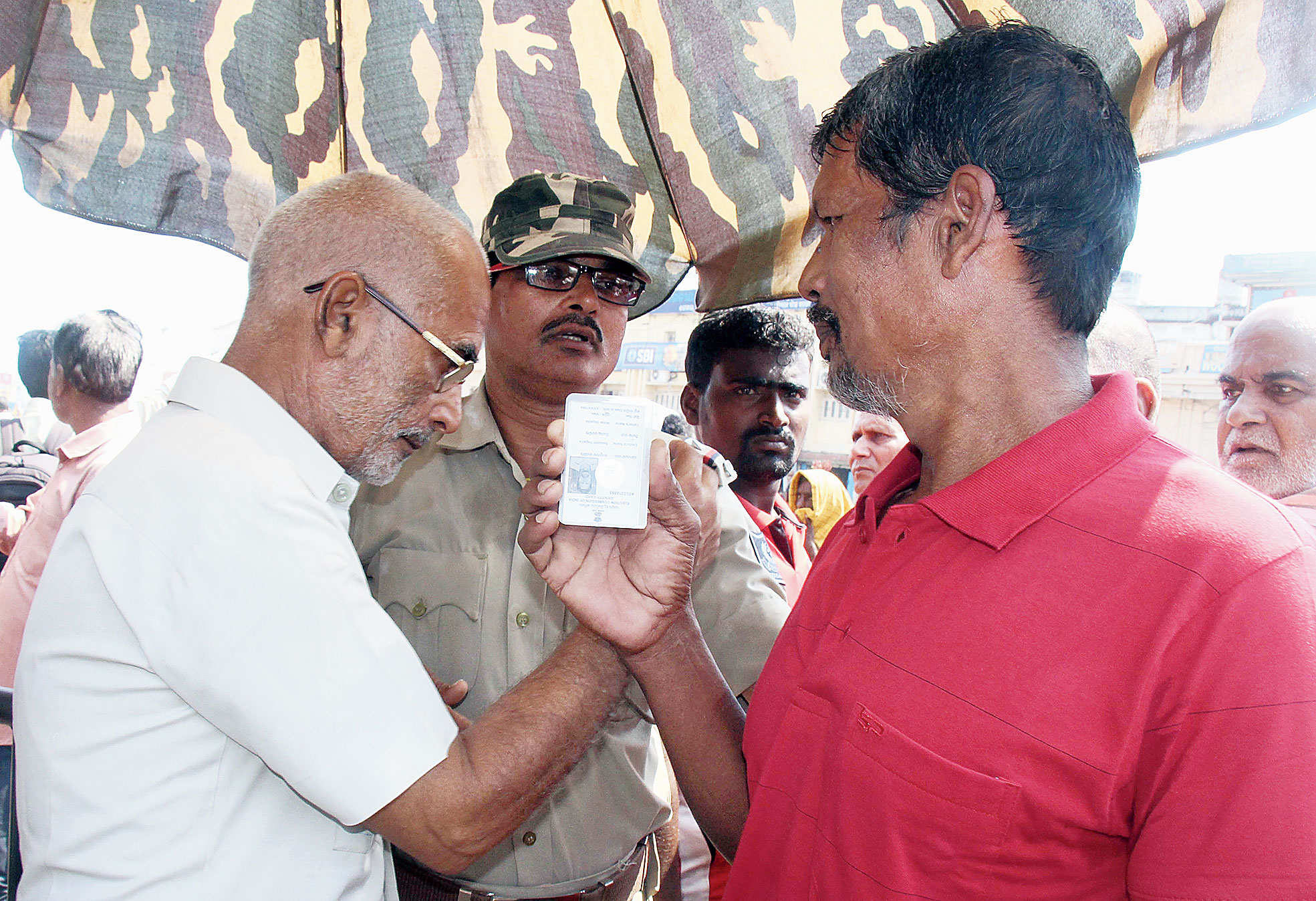 A local resident shows his identity card to get inside the shrine in Puri on Thursday