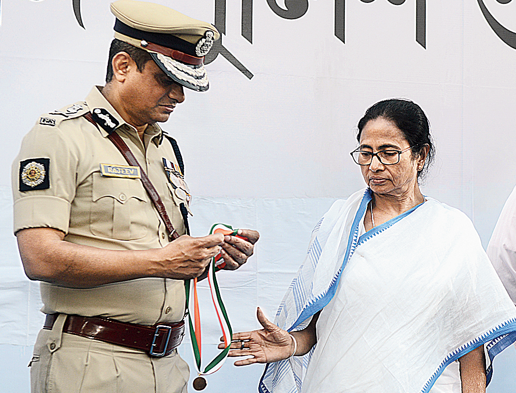 Mamata and Calcutta police commissioner Rajeev Kumar during the presentation of medals in the Metro Channel on Monday. 

