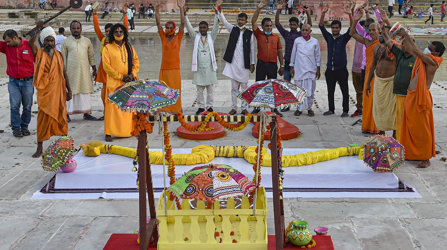 A large Khadau (wooden slippers), bow and arrow, and palanquin put on display at Naya Ghat in Ayodhya on Tuesday