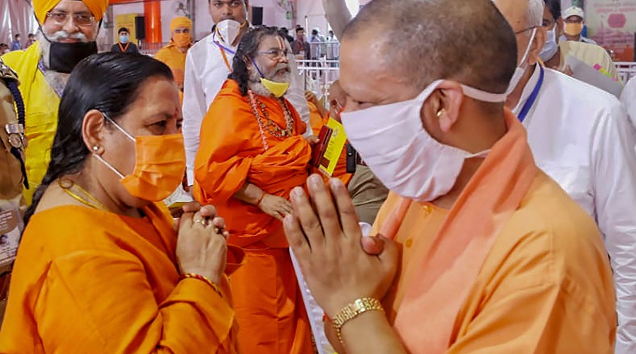 Uttar Pradesh Chief Minister Yogi Adityanath being greeted by BJP leader Uma Bharti in Ayodhya on Wednesday