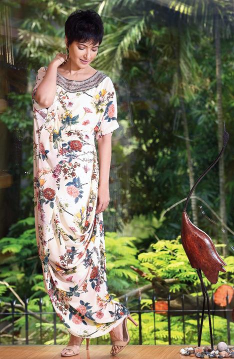 1. This floral printed, draped outfit with a dash of bright colours against a soothing lemon base with a comfortable neckline exudes an elegant-carefree style. “This floral-motif drape in georgette has ornamental embroidery with pearls and sequins around the neck. It is sensual, romantic, soft and each piece in this print-drape collection has an exclusive drape with no two identical pieces and encompasses all the best shades of yellow,” said Jyotee.
