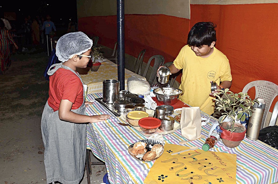 A young chef serves a customer