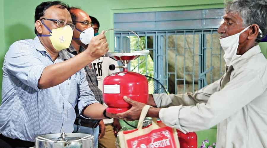Mini-LPG cylinders being distributed in the Basirhat sub-division of the Sunderbans on Friday. 