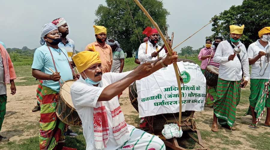 People celebrate World Tribal Day at Sundernagar near Jamshedpur on Sunday. 