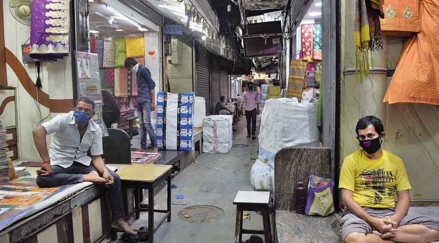Garment traders on MG Road wait for customers