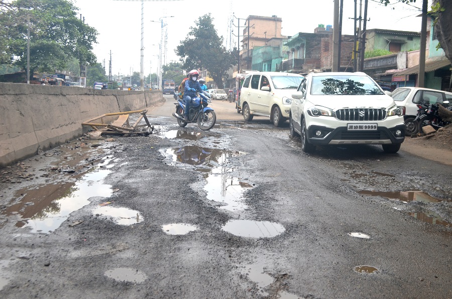 Potholes on Jharia-Bank mor road at Bastakola, Jharia on Thursday