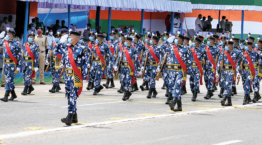The city police’s Rapid Action Force personnel march down Red Road during the celebrations