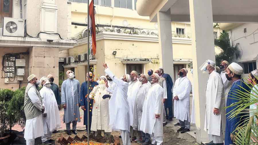 Members of the Dawoodi Bohra community in Calcutta hoist the Tricolour at the Burhani Masjid in Topsia on Saturday morning