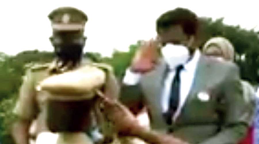 Inspector M. Allirani salutes collector K.S. Kandasamy