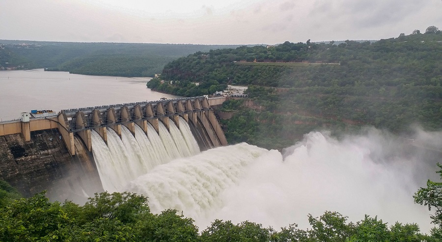 Srisailam dam opens its eight gates to control the water level following heavy rains, in Kurnool district on Thursday.