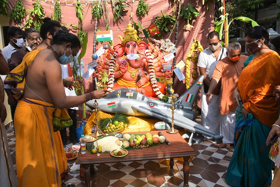 Priests and devotees offer prayers at the state BJP office in Chennai on Saturday.
