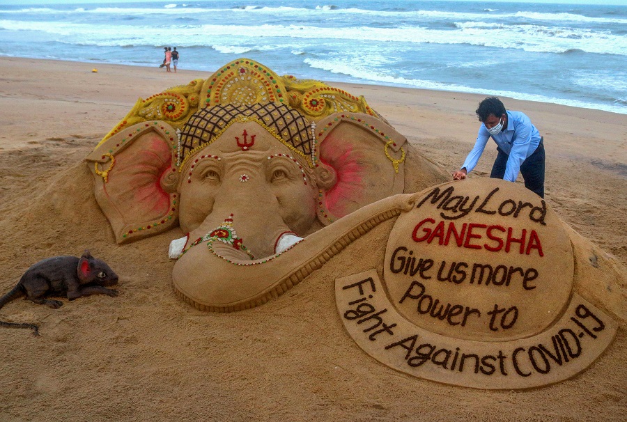 Sand artist Sudarsan Pattnaik creates a sand sculpture on the occasion of Ganesh Chaturthi, at Puri beach in Odisha on Friday.
