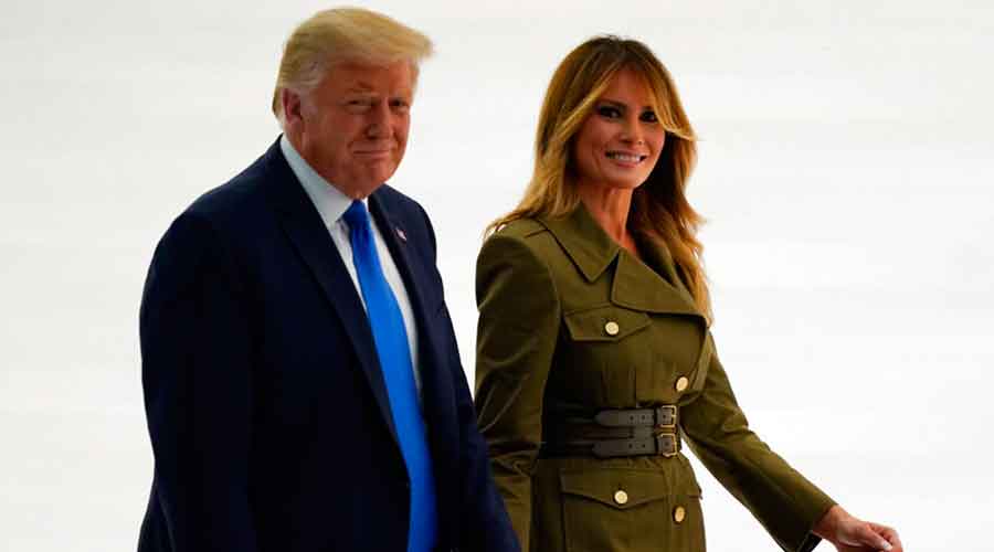 President Donald Trump leaves with first lady Melania Trump after her speech to the 2020 Republican National Convention from the Rose Garden of the White House, Tuesday, August 25, 2020, in Washington. 