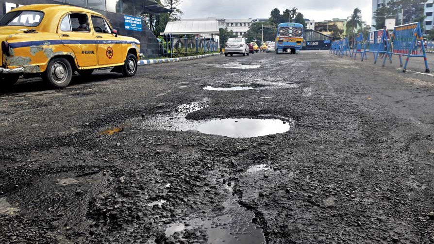A potholed stretch at the EM Bypass-Broadway crossing on Wednesday.