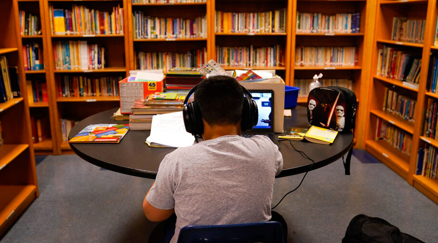 A Los Angeles Unified School District student attends an online class at Boys & Girls Club of Hollywood in Los Angeles, Wednesday, August 26, 2020.