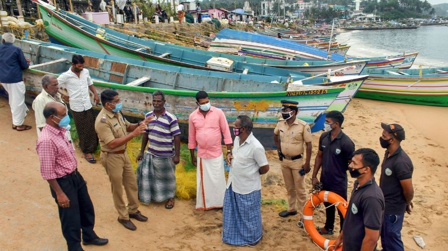 Police and coast guard personnel create awareness among fishermen in Thiruvananthapuram in view of Cyclone Burevi on Wednesday.