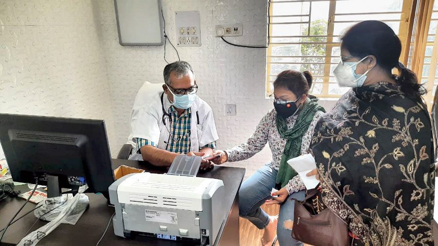 A patient being checked by the doctor at the health centre.