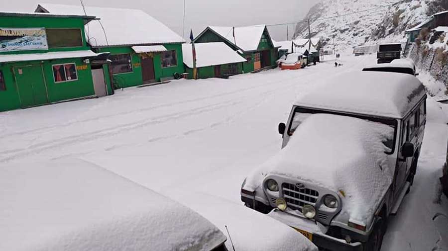 An SUV with a heap of snow on the bonnet in East Sikkim 