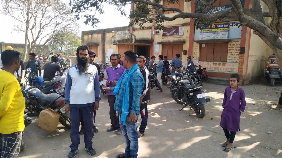 People gathered around Indian Bank CSP at Fularitand in Baghmara Block in Dhanbad where the robbery  took place on Monday morning.