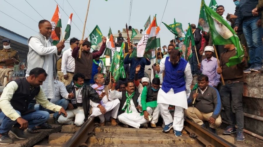 Party workers of JMM demonstrate sit-in on a railway tracks in Bokaro to support Bharat Bandh called by farmers on Tuesday.