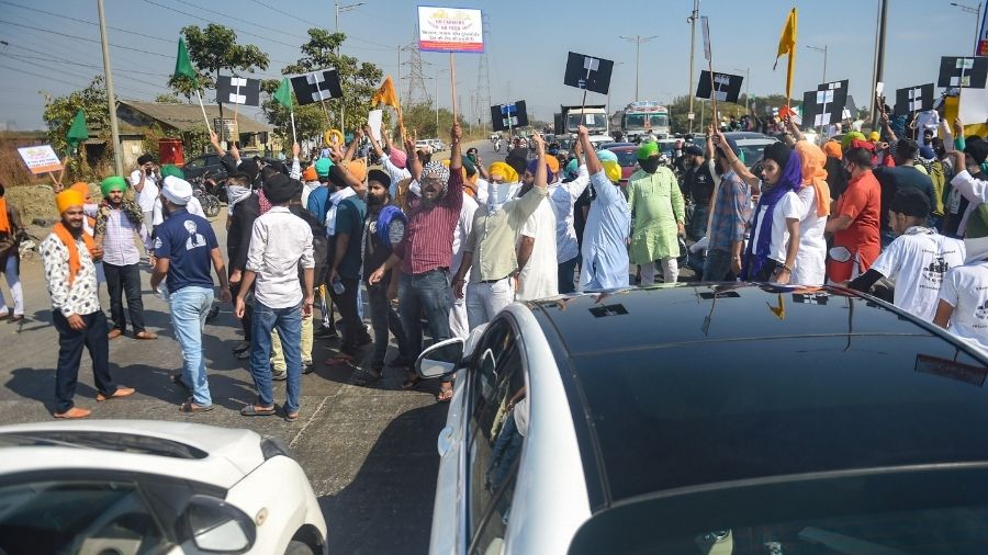 Members of the Sikh community block traffic at the Sion-Panvel highway in Mumbai on Tuesday.