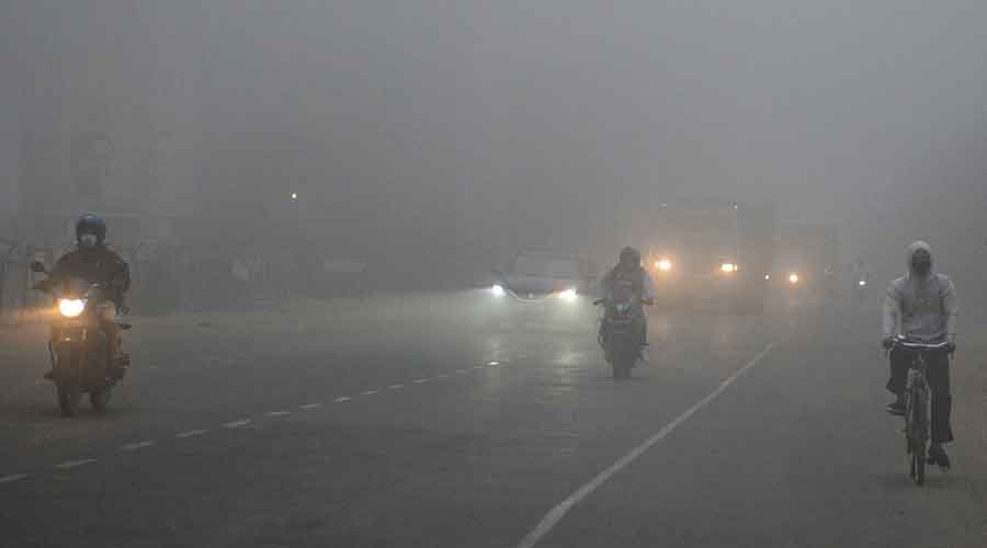 Vehicles on a fog-covered EM Bypass ply with their headlights on around 6.30am on Tuesday. 