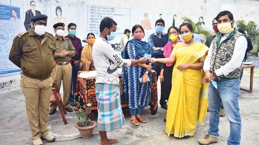 A prisoner receives a Swasthya Sathi card at a Duare Sarkar camp  at the Rampurhat jail on Tuesday