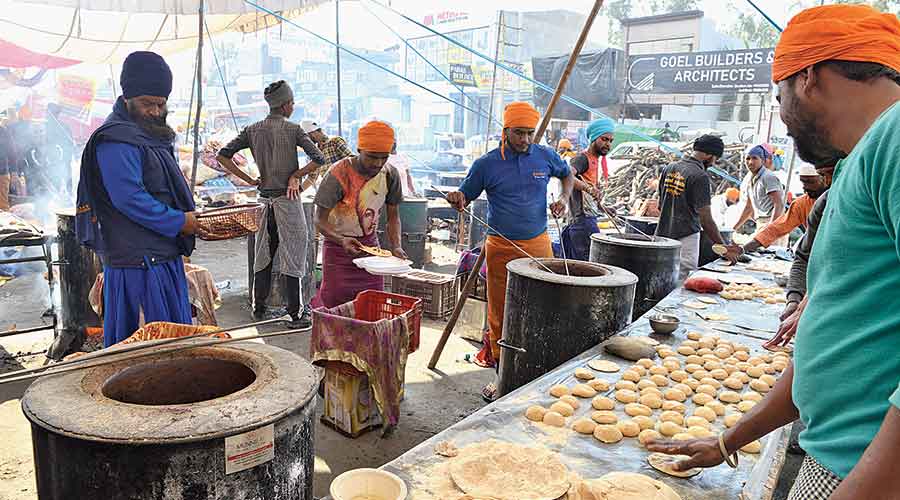 Protesting farmers and volunteers cook for the langar for the farmers, who are living on the highway for almost two weeks
