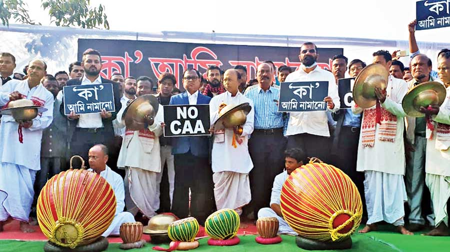 AASU members protesting against CAA in Guwahati on Saturday  with a troupe playing traditional musical instruments.