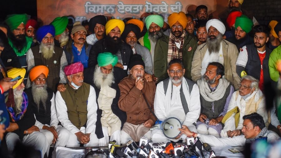 Farmer union leaders address a press conference at the Singhu border near Delhi on Wednesday.