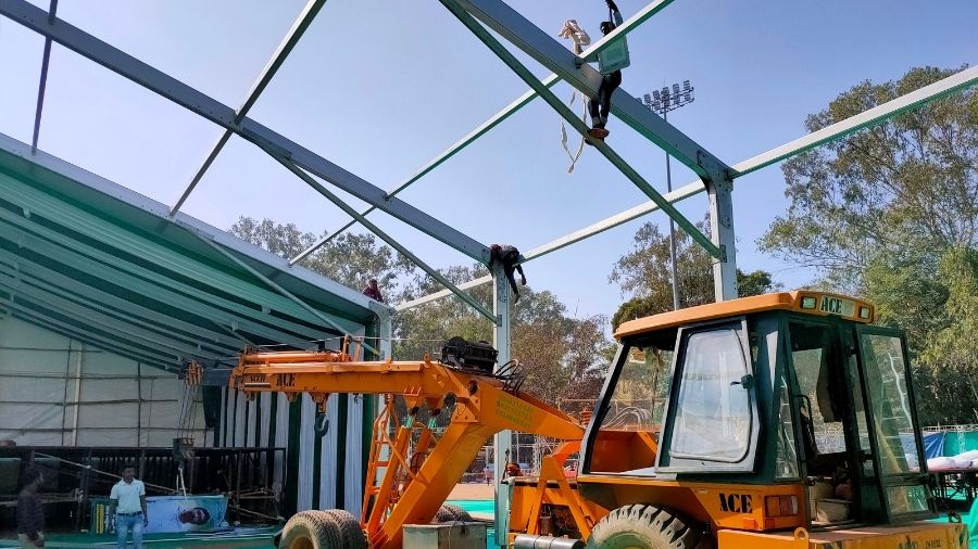 Workers prepare the structure of the stage, where the one-year anniversary programme of the Hemant government is set to be held, at the Morabadi Stadium in Ranchi, on Sunday.