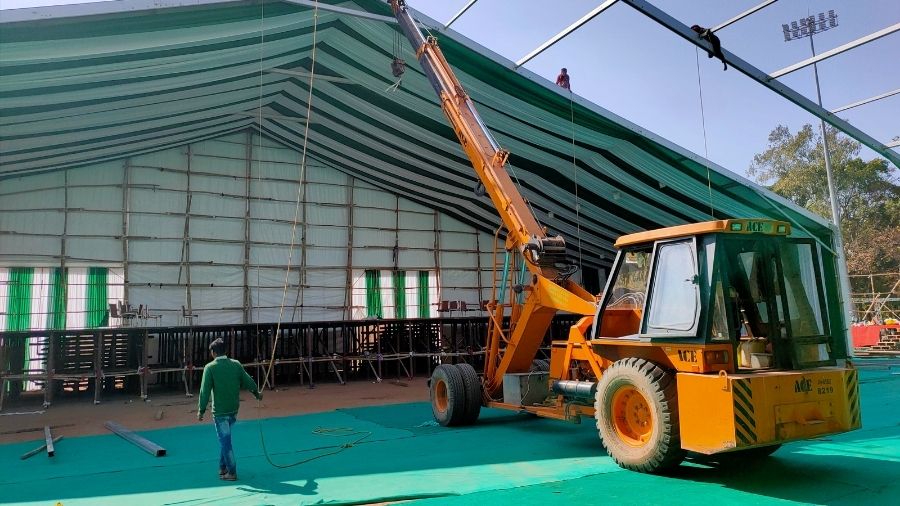 Cranes being used to prepare the stage for the December 29 event at the Morabadi Stadium in Ranchi, on Sunday.