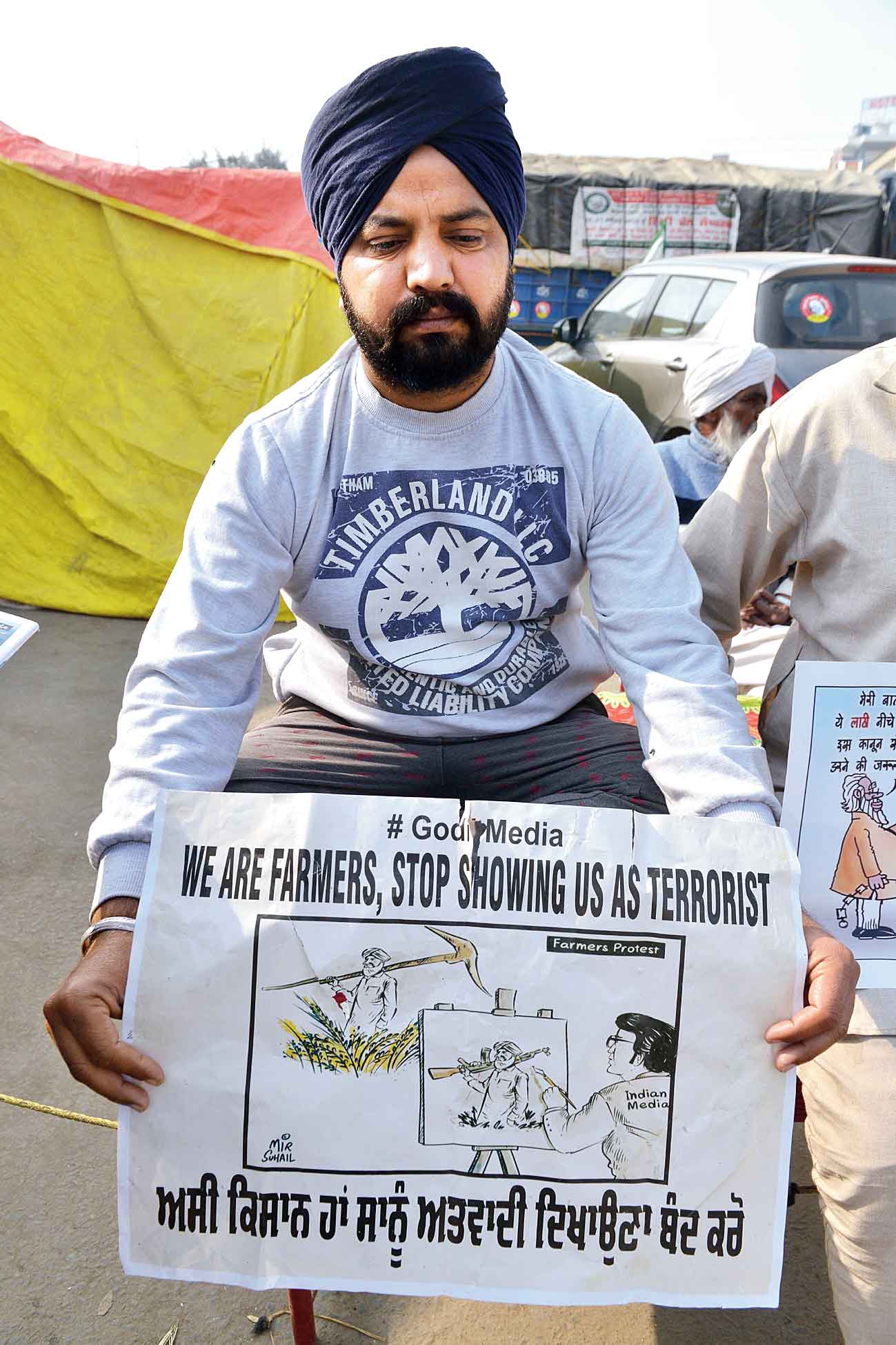 A farmer protests at the Singhu border