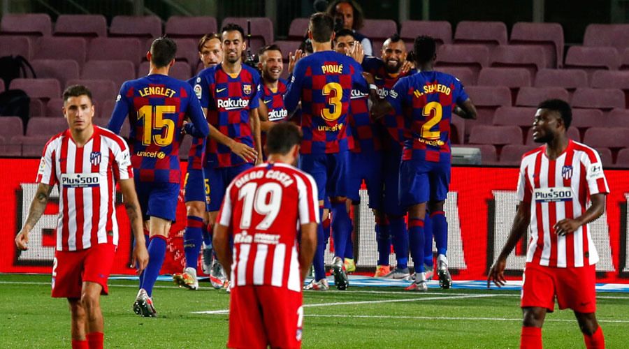 FC Barcelona, background, celebrate their side's second goal during the Spanish La Liga.