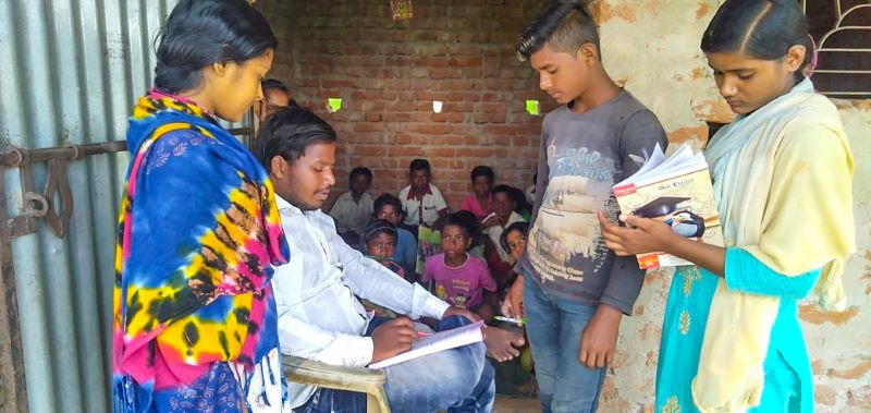 Neeraj Murmy (22) helping youngsters in his village school in Giridih