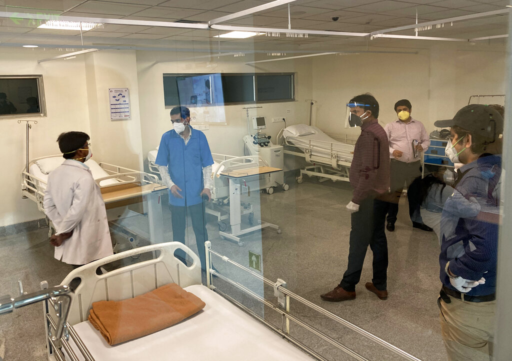 Doctors and hospital staff stand inside a blood plasma bank that was inaugurated Thursday in New Delhi, Thursday, July 2, 2020.