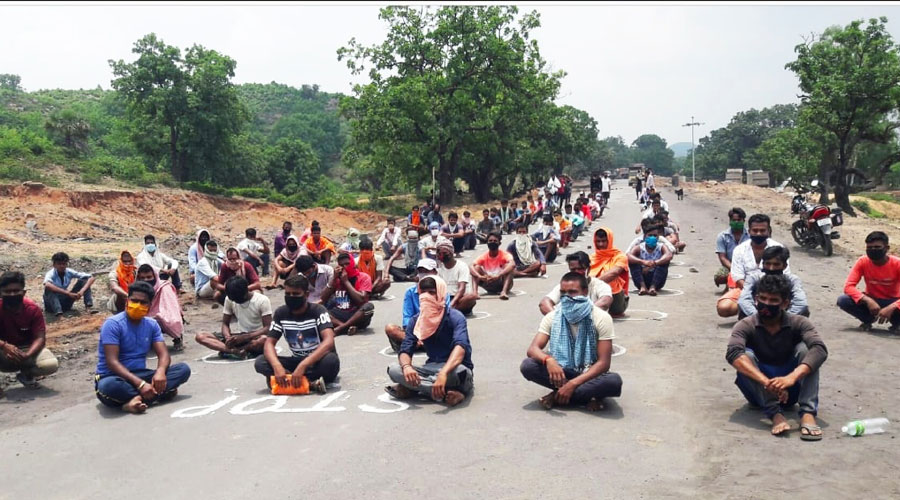 Villagers sit on the Hazaribagh-Barkagaon road blocking coal transportation on Friday.