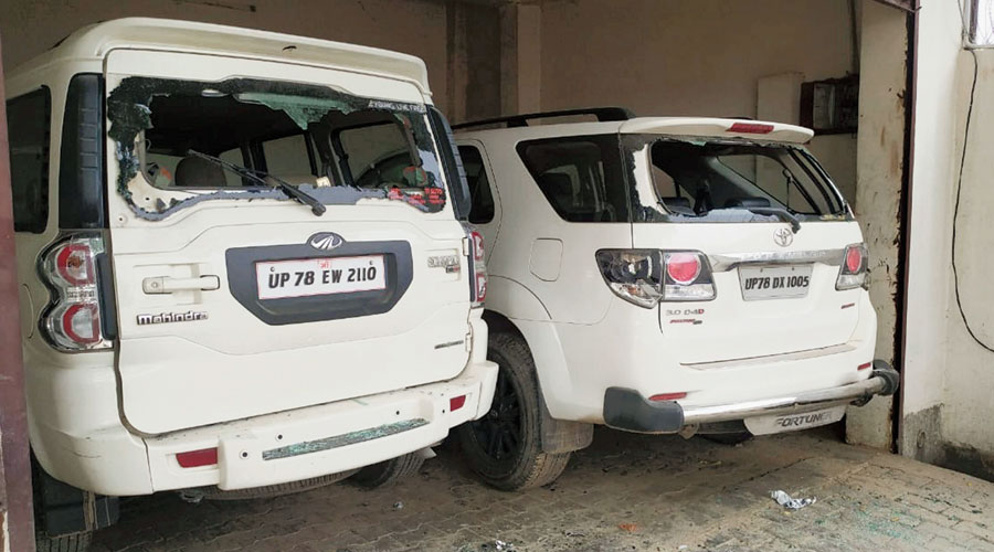 Cars with shattered windowpanes parked inside gangster Vikas Dubey’s house. (PTI)