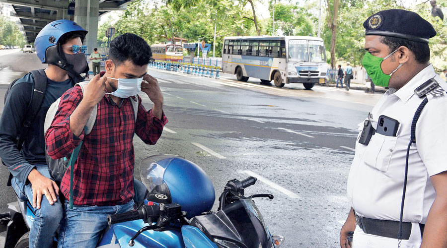 The biker wears the mask